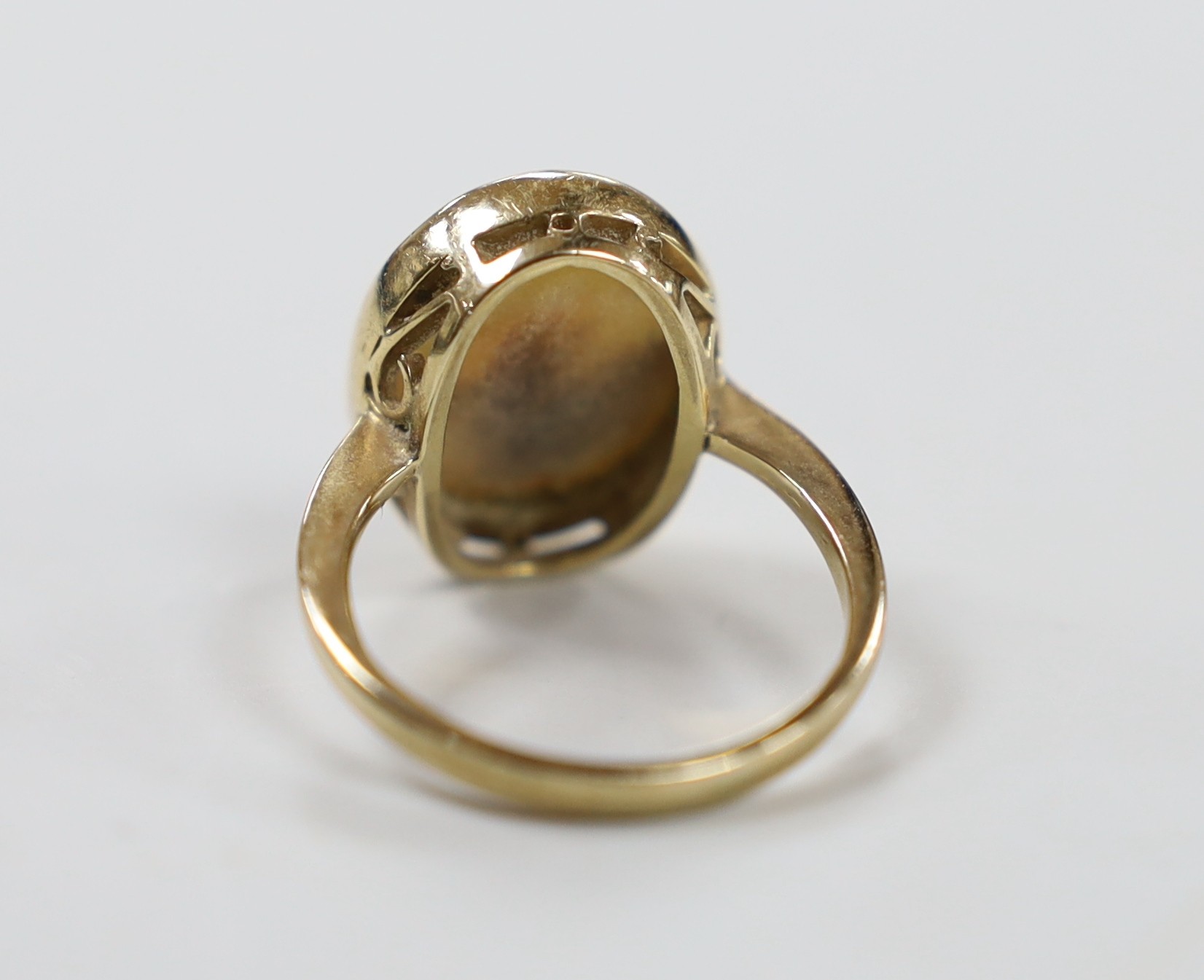 A 9ct and oval black opal set ring, size O, gross weight 4.3 grams.
